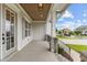 Covered front porch with stone accents and view of neighborhood at 812 Willow Tower Ct # 155, Rolesville, NC 27571