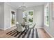 Charming breakfast nook with a round table and striped rug at 812 Willow Tower Ct # 155, Rolesville, NC 27571