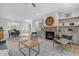 Open living room with stone fireplace and access to backyard deck at 812 Willow Tower Ct # 155, Rolesville, NC 27571