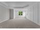 Bright bedroom with neutral walls, carpeted floors, and large windows at 812 Willow Tower Ct # 155, Rolesville, NC 27571