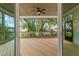 Relaxing screened porch with wood decking and ceiling fan at 812 Willow Tower Ct # 155, Rolesville, NC 27571