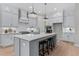 Modern kitchen boasts ample cabinetry, large island, and stainless steel appliances at 812 Willow Tower Ct # 155, Rolesville, NC 27571