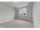 Well-lit bedroom with carpet and a window at 812 Willow Tower Ct # 155, Rolesville, NC 27571