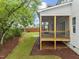 Screened porch with wooden deck and backyard view at 812 Willow Tower Ct # 155, Rolesville, NC 27571