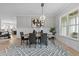 Spacious dining area with hardwood floors and a stylish chandelier at 812 Willow Tower Ct # 155, Rolesville, NC 27571