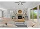 Cozy living room with a stone fireplace, built-in shelving, and hardwood floors at 812 Willow Tower Ct # 155, Rolesville, NC 27571