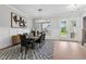 Elegant dining room features a large table, chandelier, and hardwood floors at 812 Willow Tower Ct # 155, Rolesville, NC 27571
