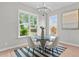 Breakfast nook with glass table, four chairs, and a large window at 812 Willow Tower Ct # 155, Rolesville, NC 27571