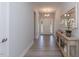 Bright and airy entryway featuring a console table and mirror at 157 Newport Landing # 95, Garner, NC 27529