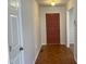 Entryway with parquet flooring and red door at 7622 Lindley Mill Rd, Graham, NC 27253