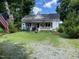 Charming farmhouse with front porch at 7622 Lindley Mill Rd, Graham, NC 27253