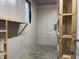 Unfinished workshop with shelves and workbenches at 7622 Lindley Mill Rd, Graham, NC 27253