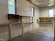 Spacious workshop with ample storage and workbenches at 7622 Lindley Mill Rd, Graham, NC 27253