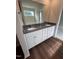 Double vanity bathroom with granite countertop and large mirror at 31 Grace Ridge Ct, Benson, NC 27504
