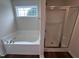 Bathroom with soaking tub and separate shower at 31 Grace Ridge Ct, Benson, NC 27504
