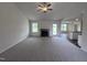 Spacious living room featuring a fireplace and carpeting at 31 Grace Ridge Ct, Benson, NC 27504
