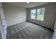 Bright bedroom with carpet flooring and large windows at 31 Grace Ridge Ct, Benson, NC 27504