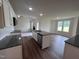 Open concept kitchen with island and stainless steel appliances at 31 Grace Ridge Ct, Benson, NC 27504