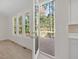 Open door reveals deck overlooking wooded area at 146 Wood Wedge, Sanford, NC 27332
