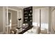 Bright home office with built-in shelving and a large desk at 5628 Bella Terra Ct, Wake Forest, NC 27587