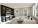 Home bar with ample storage, wine cooler, and comfortable seating at 5628 Bella Terra Ct, Wake Forest, NC 27587