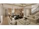 Open living room and kitchen with hardwood floors and modern lighting at 5628 Bella Terra Ct, Wake Forest, NC 27587