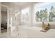 Spa-like bathroom featuring a freestanding tub and glass shower at 5628 Bella Terra Ct, Wake Forest, NC 27587