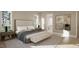 Spacious bedroom with large windows and a cozy sitting area at 5628 Bella Terra Ct, Wake Forest, NC 27587