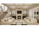 Spacious living room with two sofas, a fireplace, and a large TV at 5628 Bella Terra Ct, Wake Forest, NC 27587