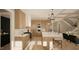 Modern kitchen with light wood cabinets and marble island at 5628 Bella Terra Ct, Wake Forest, NC 27587