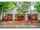 White brick commercial building with red doors and large windows at 600 Rocky Knob Ct, Raleigh, NC 27601