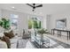 Bright living room with comfy seating, large windows, and a stylish coffee table at 600 Rocky Knob Ct, Raleigh, NC 27601