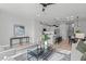 Open concept living area with modern furniture and a view into the kitchen and dining area at 600 Rocky Knob Ct, Raleigh, NC 27601