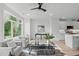 Spacious living room features large windows and an open floor plan at 602 Rocky Knob Ct, Raleigh, NC 27601