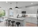 Modern kitchen with white cabinets and island at 602 Rocky Knob Ct, Raleigh, NC 27601