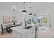 Modern kitchen with white cabinets and island at 602 Rocky Knob Ct, Raleigh, NC 27601