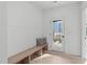 Light-filled entryway with built-in bench and door to backyard at 614 Rocky Knob Ct, Raleigh, NC 27601