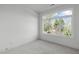Bright bedroom with large window offering treetop views at 614 Rocky Knob Ct, Raleigh, NC 27601