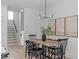 Light-filled dining room with a wood table and black chairs at 614 Rocky Knob Ct, Raleigh, NC 27601