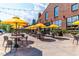 Outdoor patio area with yellow umbrellas, tables, and chairs, ideal for relaxing at 614 Rocky Knob Ct, Raleigh, NC 27601