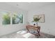 Home office with large window, desk, and comfortable seating at 614 Rocky Knob Ct, Raleigh, NC 27601