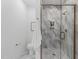 Modern bathroom featuring a glass shower door and gray marble tile at 614 Rocky Knob Ct, Raleigh, NC 27601