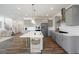 Spacious kitchen island with seating, gray cabinets, and hardwood floors at 8820 Melvin St # 16, Willow Springs, NC 27592