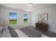 Spacious bedroom with a king-size bed and two windows with great backyard views at 8820 Melvin St # 16, Willow Springs, NC 27592