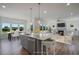 Open concept kitchen and living area with island and hardwood floors at 8820 Melvin St # 16, Willow Springs, NC 27592