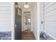 Front entry featuring a gray door and wood-look floors at 8820 Melvin St # 16, Willow Springs, NC 27592