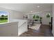 Open loft area with gray sectional sofa and hardwood floors at 8820 Melvin St # 16, Willow Springs, NC 27592