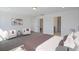 Spacious main bedroom with two armchairs and an ensuite bathroom at 8820 Melvin St # 16, Willow Springs, NC 27592