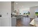 Modern kitchen with island, stainless steel appliances, and hardwood floors at 8820 Melvin St # 16, Willow Springs, NC 27592