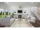 Open living room showcasing hardwood floors, fireplace, and natural light at 8820 Melvin St # 16, Willow Springs, NC 27592